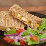 A mouthwatering cheesy chicken sandwich on toasted bread